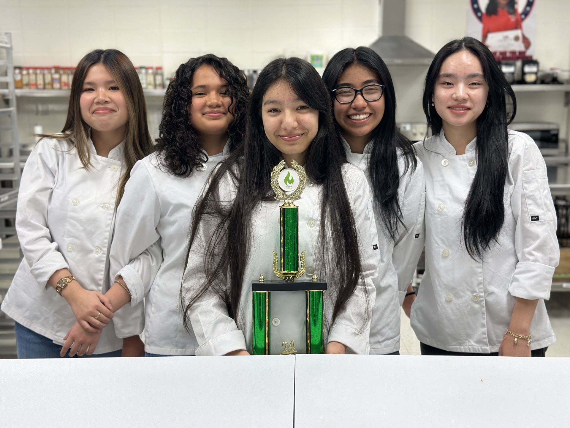 students pose with trophy